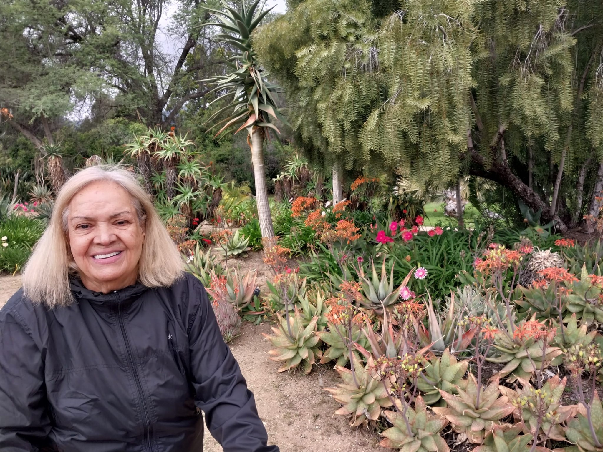 Maryam smiling in a garden
