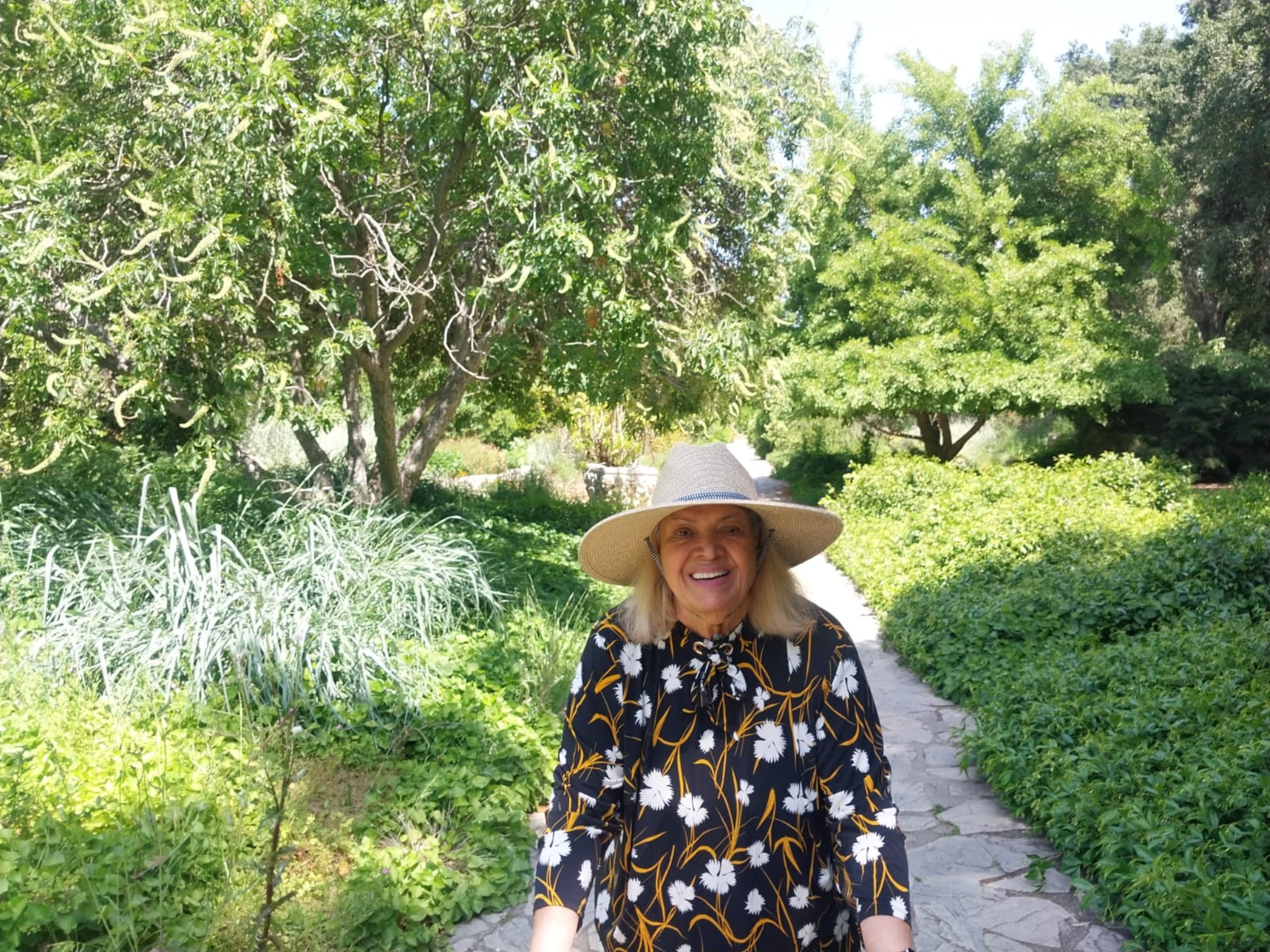 Maryam walking in a garden